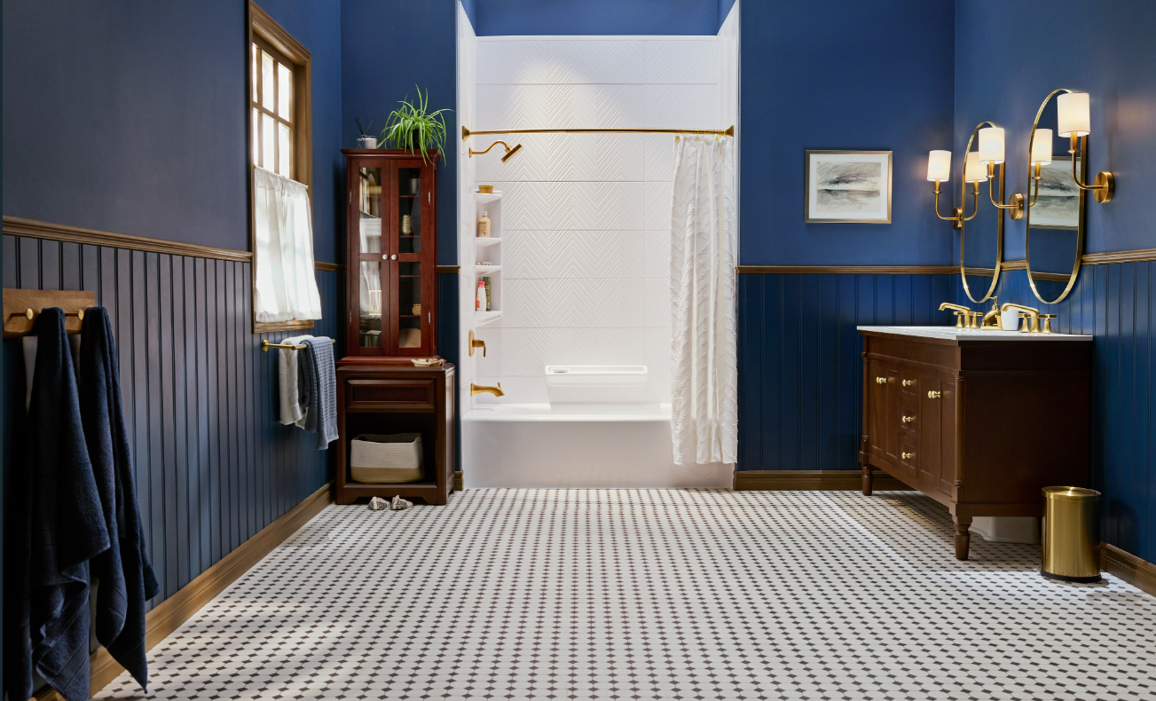 Blue bathroom with white tiled shower, dark wood vanity, and patterned floor.