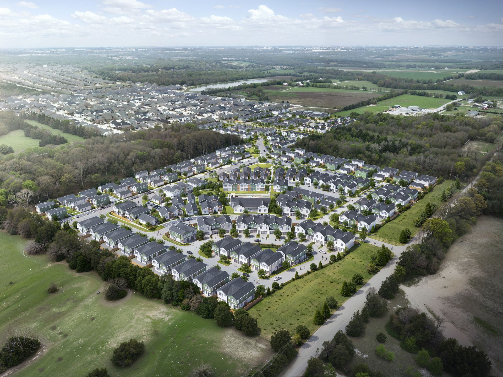 An aerial view of a residential area with lots of houses and trees