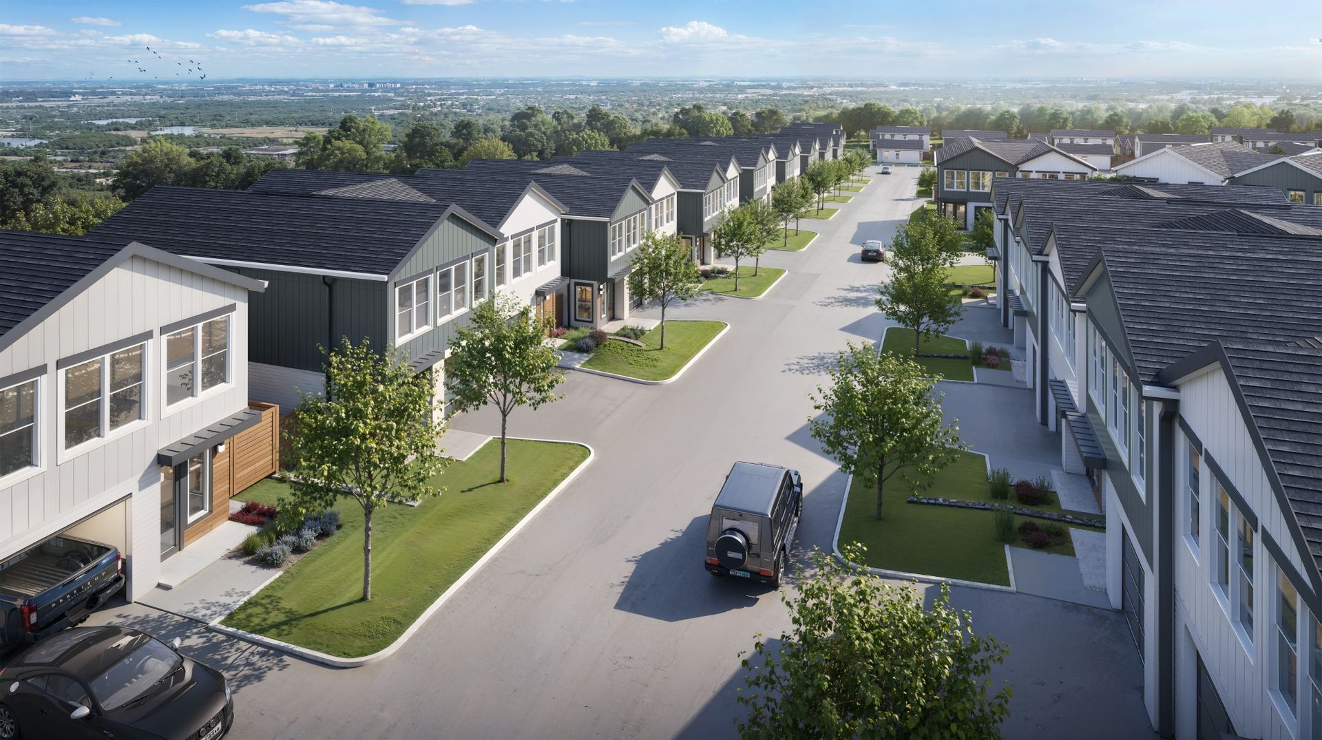 An aerial view of a residential neighborhood with a delivery truck driving down the street.
