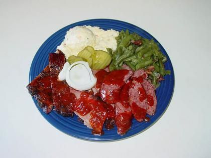 smoked ribs and sausage with sides