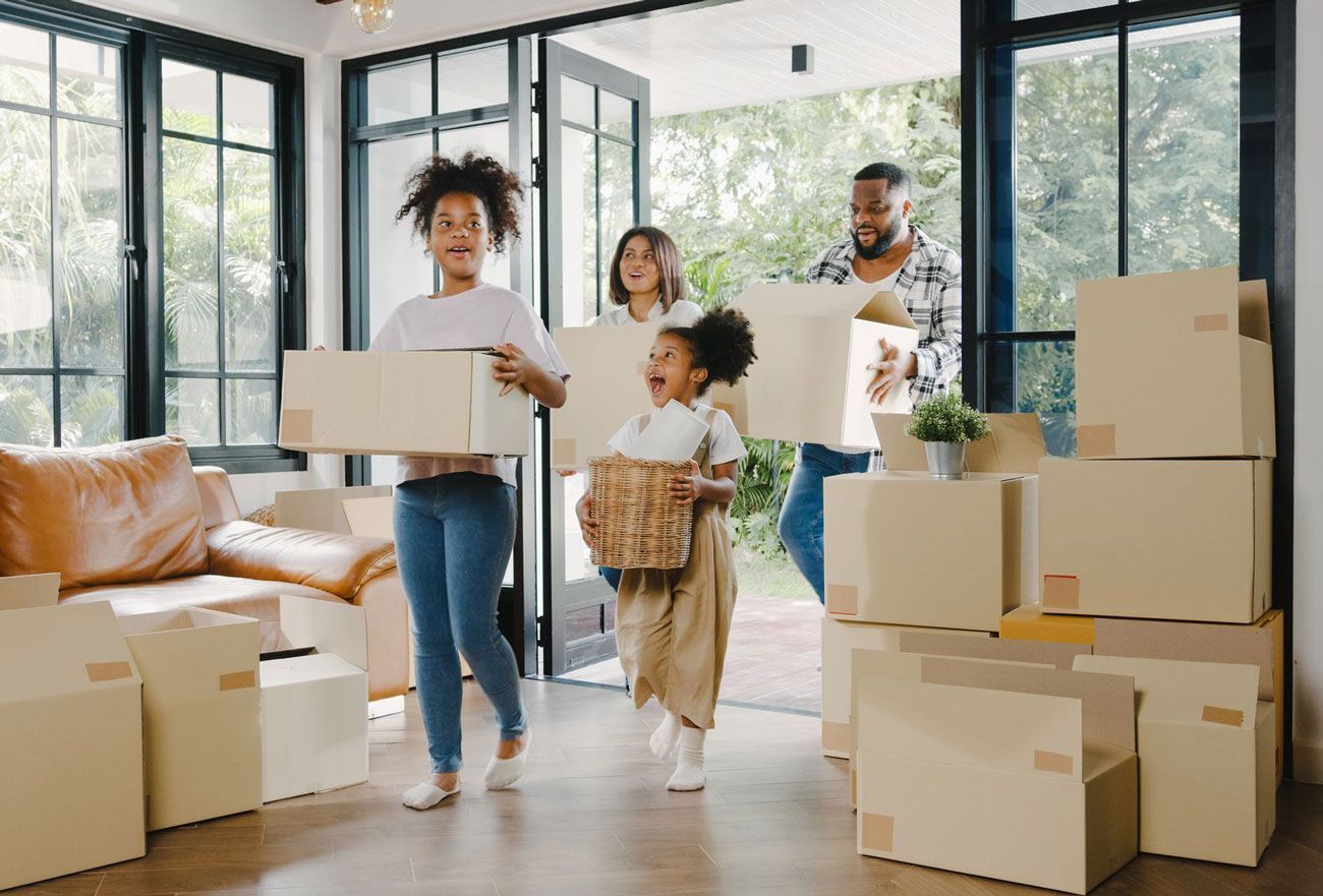 Diverse family moving in to new home