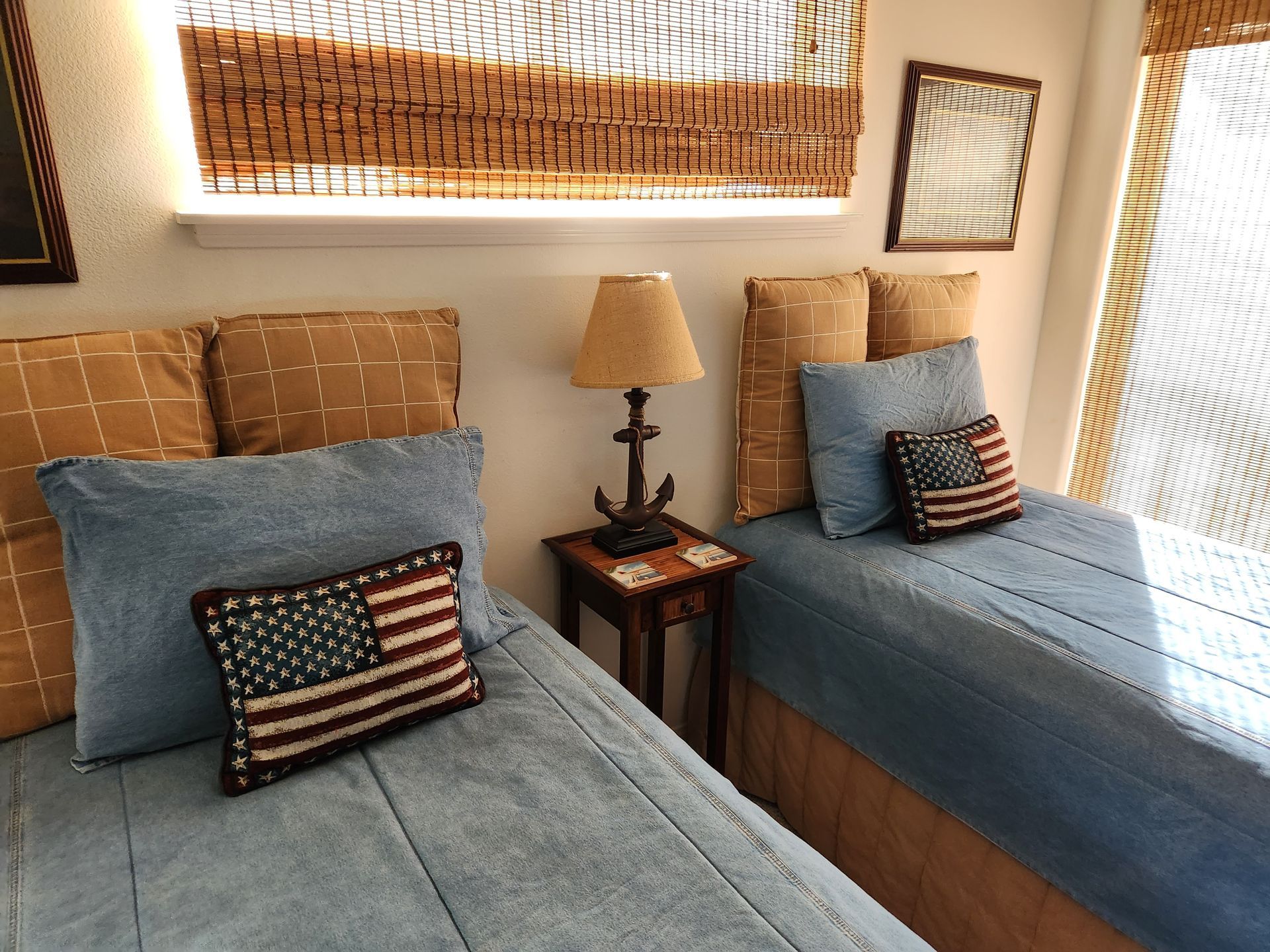 A kitchen with green cabinets and a white mixer