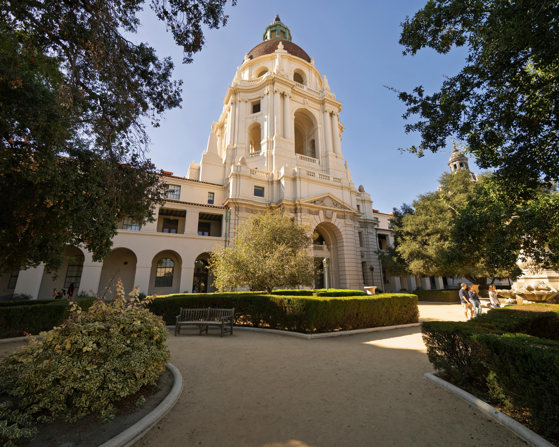 A room with green walls and a desk with a computer on it