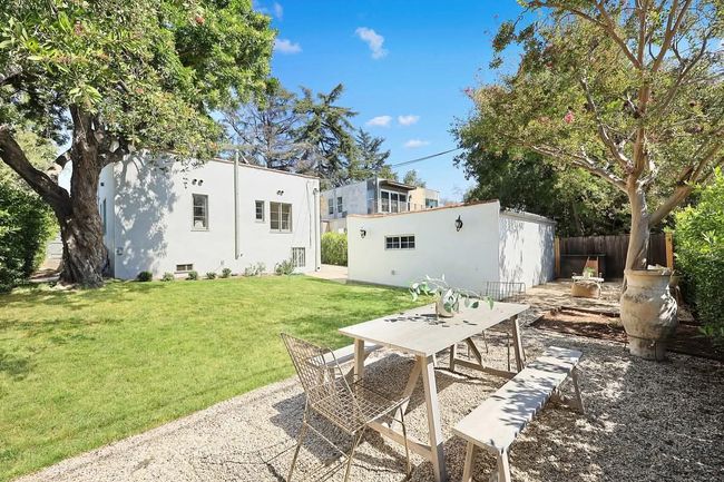 A kitchen with stainless steel appliances and granite counter tops.