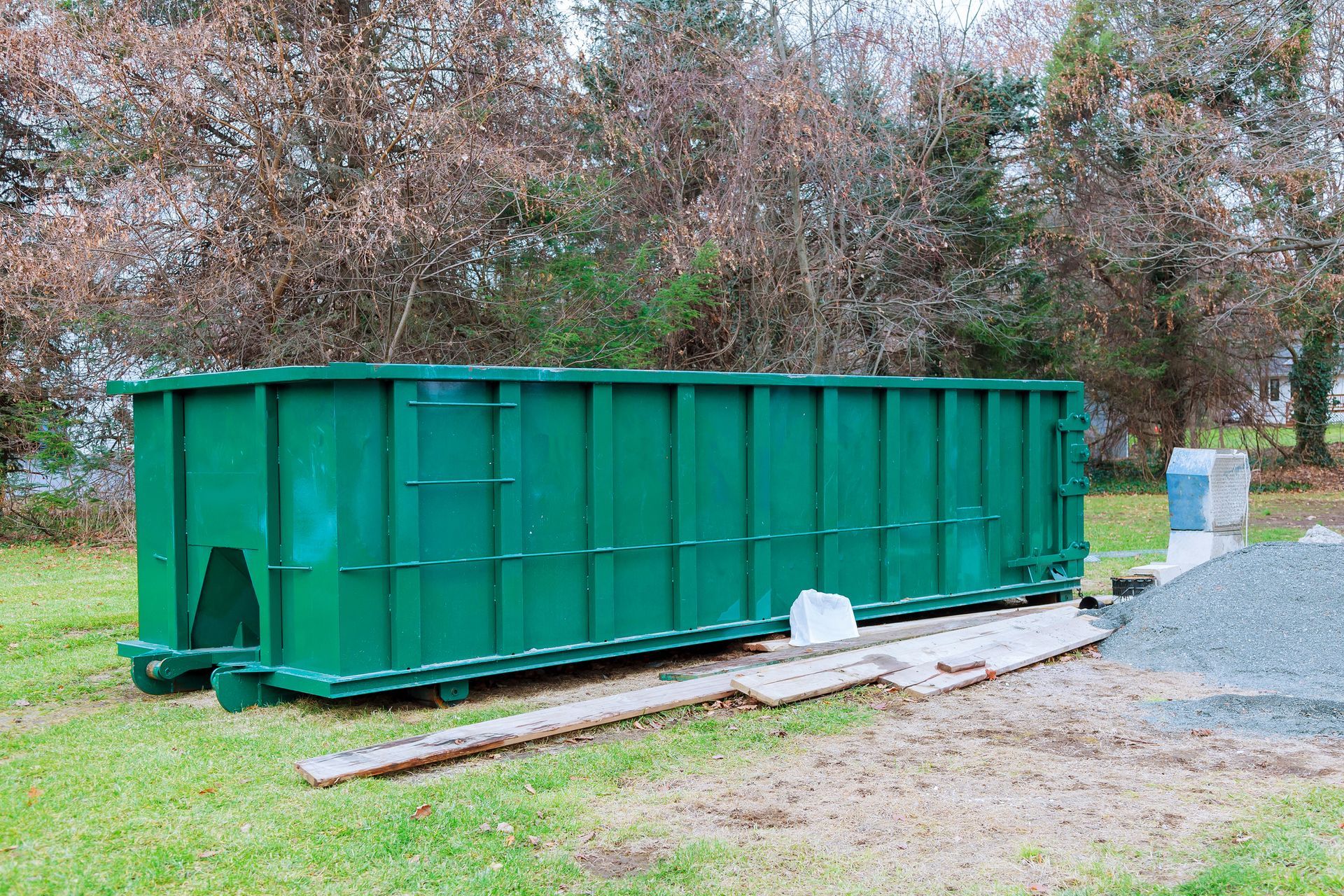 Residential construction debris in a dumpster by K & S Rolloff, providing dumpsters for rent in Terr