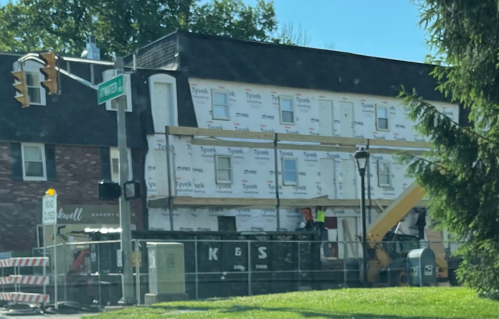 A building under construction with a fence around it