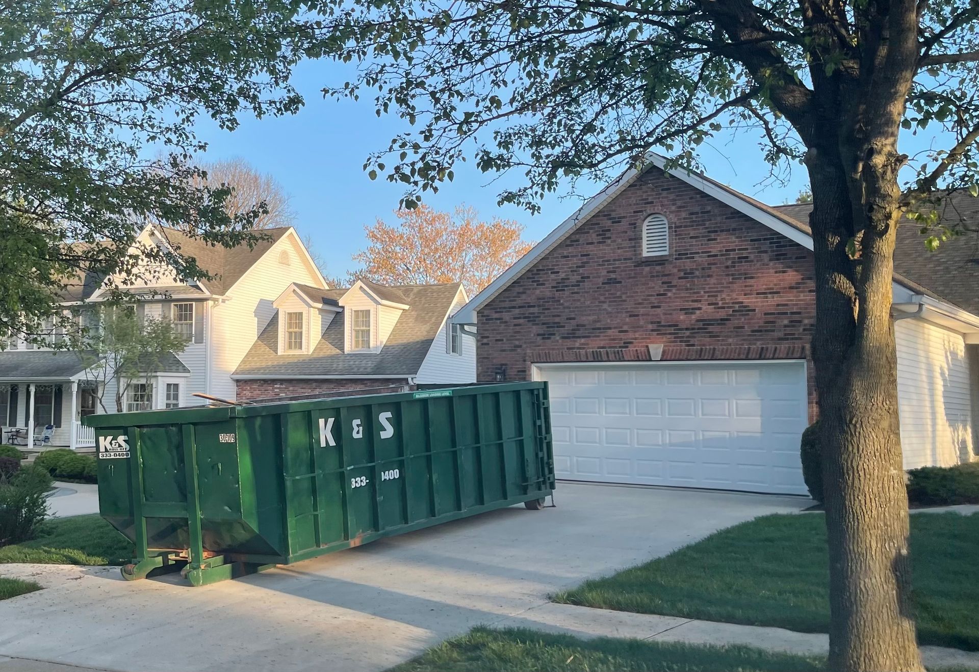 Red container with solid domestic and construction waste. Caring for the environment. Red container with solid domestic and construction waste. Caring for the environment.