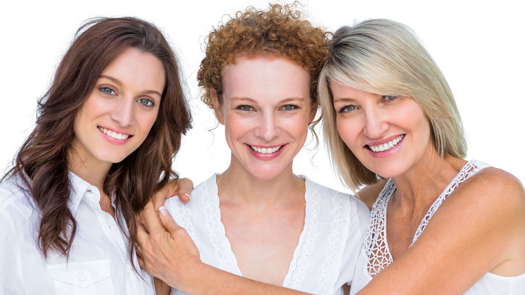 Three women are hugging each other and smiling for the camera.