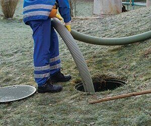 A man emptying septic tank — porta potty in Southampton, NJ A man emptying septic tank — porta potty in Southampton, NJ
