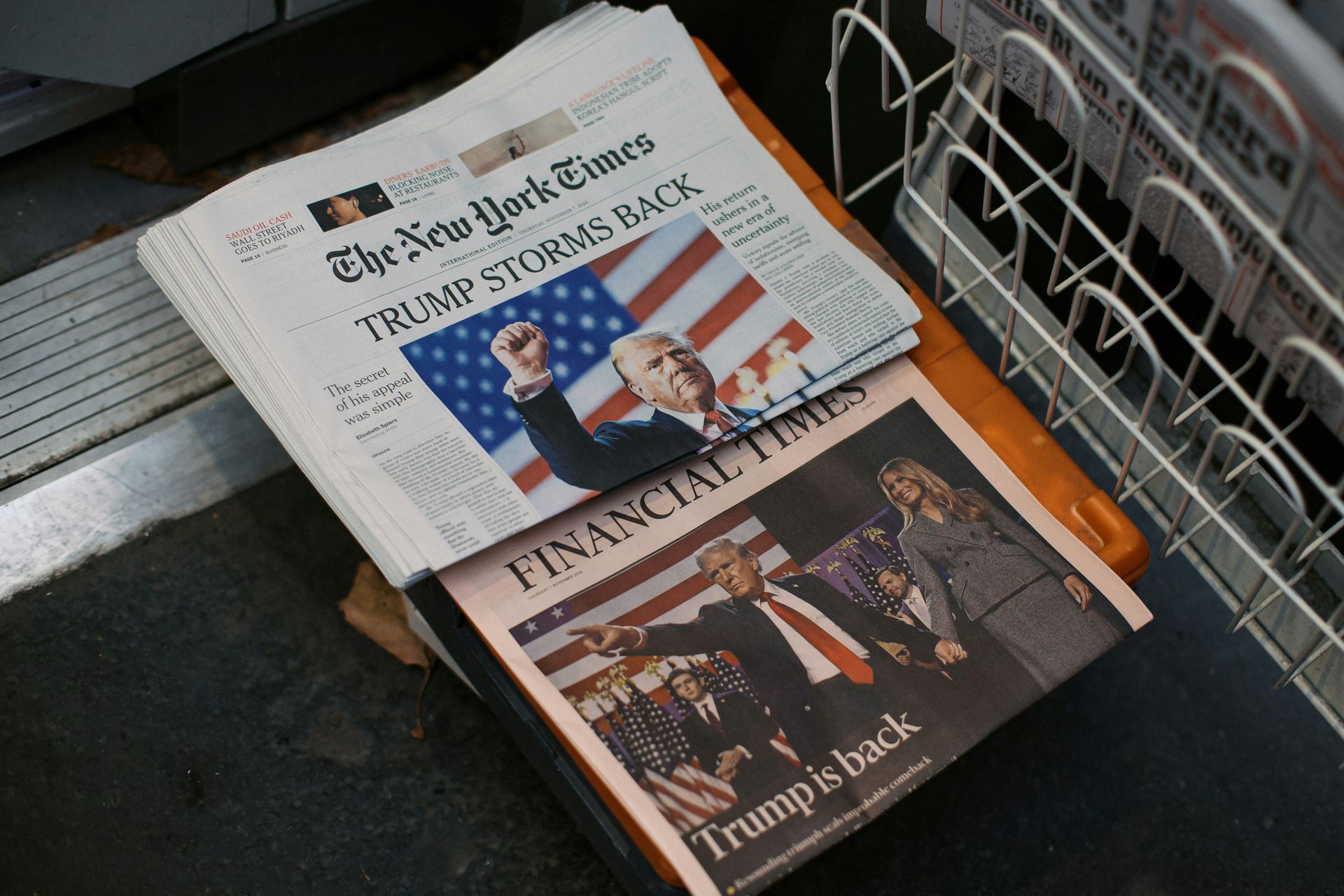 Newspapers: The New York Times and Financial Times. Trump is featured on both front pages.