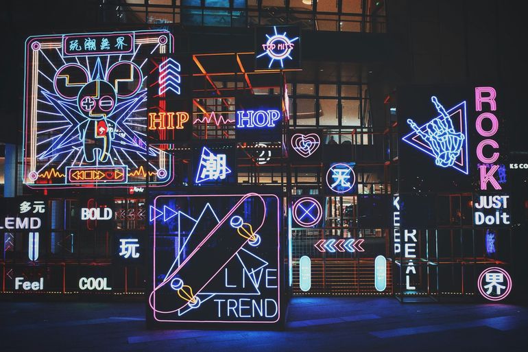 A neon sign that says live trend on it