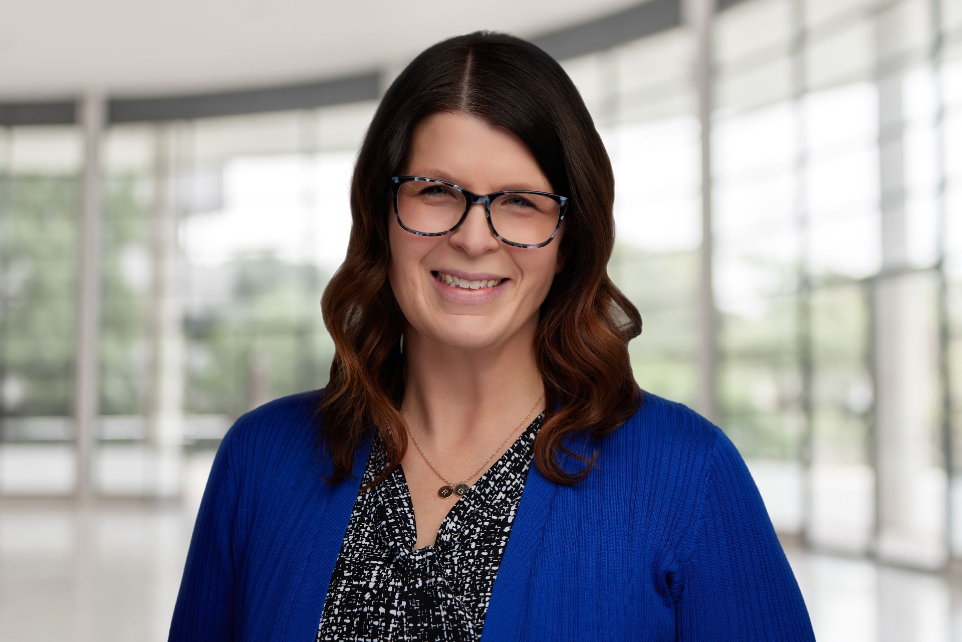 A picture of a person sitting at a desk with the words `` photo coming soon ''.