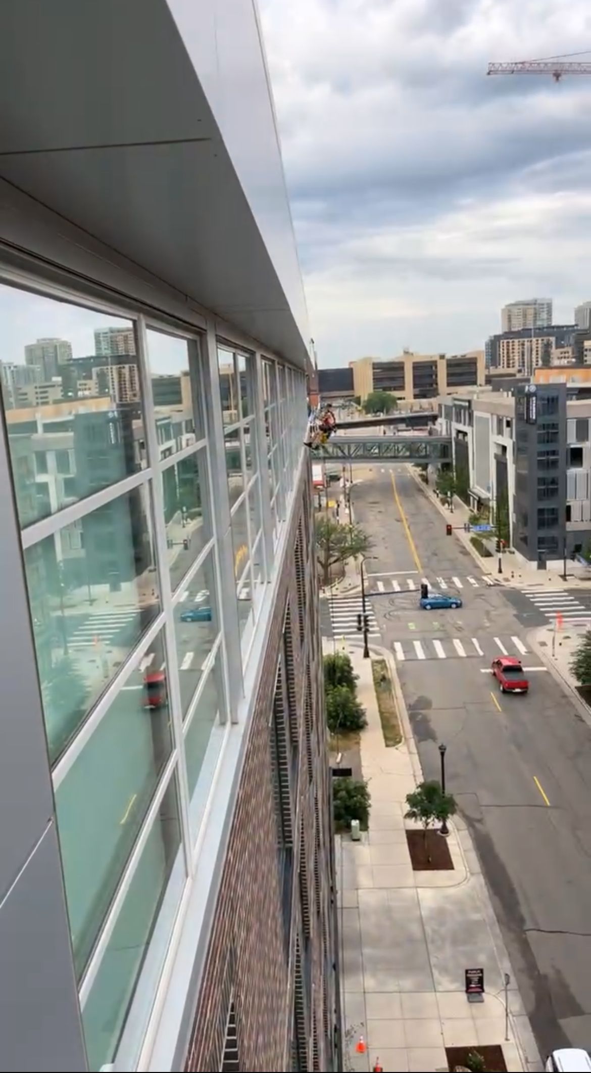 An aerial view of a city street from the top of a building.
