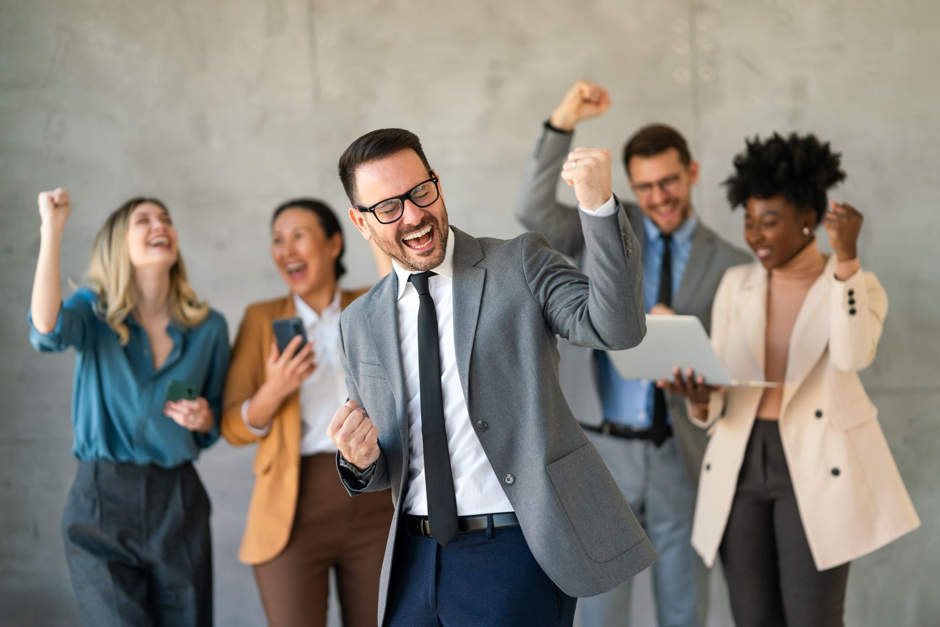 A group of business people are celebrating their success.