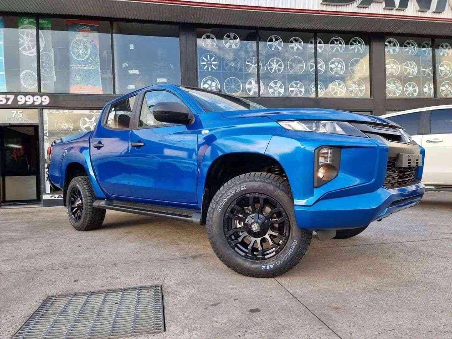 A Blue Truck is Parked in Front of a Building — Stamford Tyres In Ballarat Central, VIC