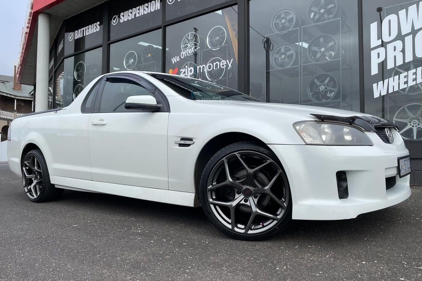 A White Pickup Truck is Parked in Front of a Store — Stamford Tyres In Ballarat Central, VIC