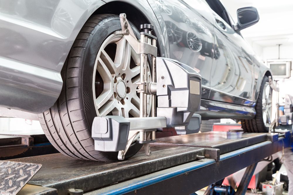 A Car is Being Aligned With a Machine in a Garage — Stamford Tyres In Ballarat Central, VIC