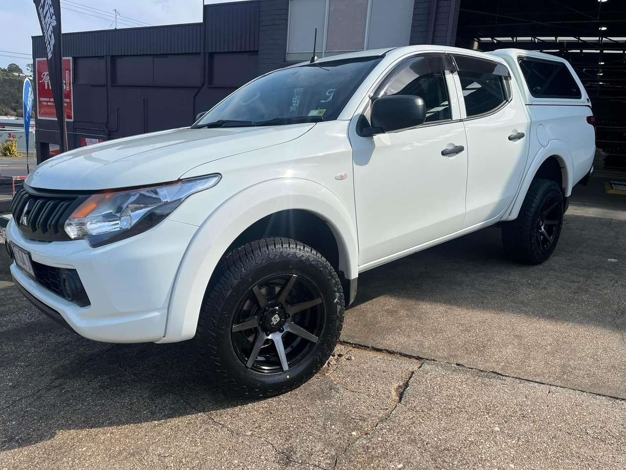 A White Truck is Parked in Front of a Building — Stamford Tyres In Ballarat Central, VIC