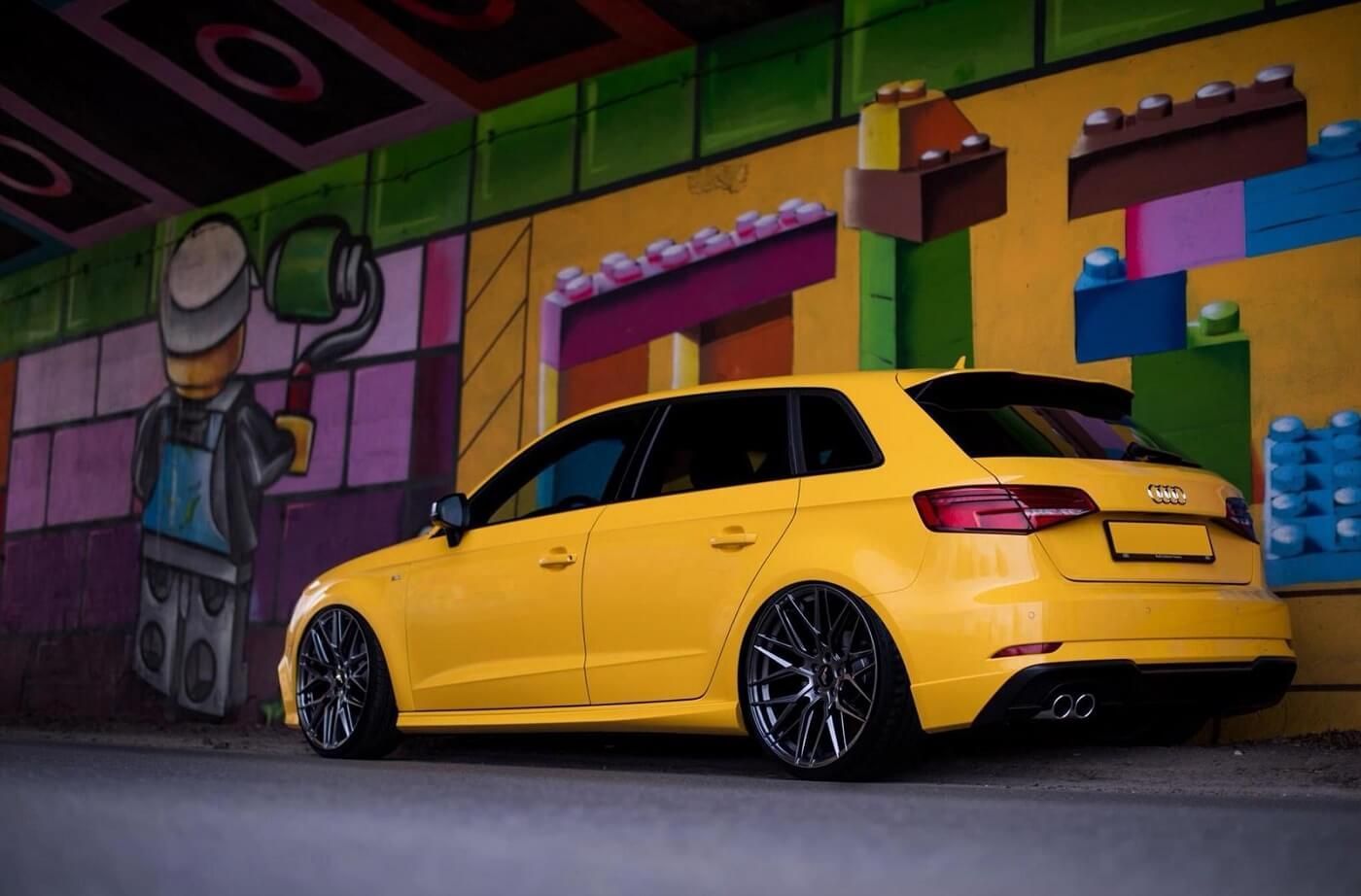 A Yellow Car is Parked in Front of a Lego Wall — Stamford Tyres In Ballarat Central, VIC