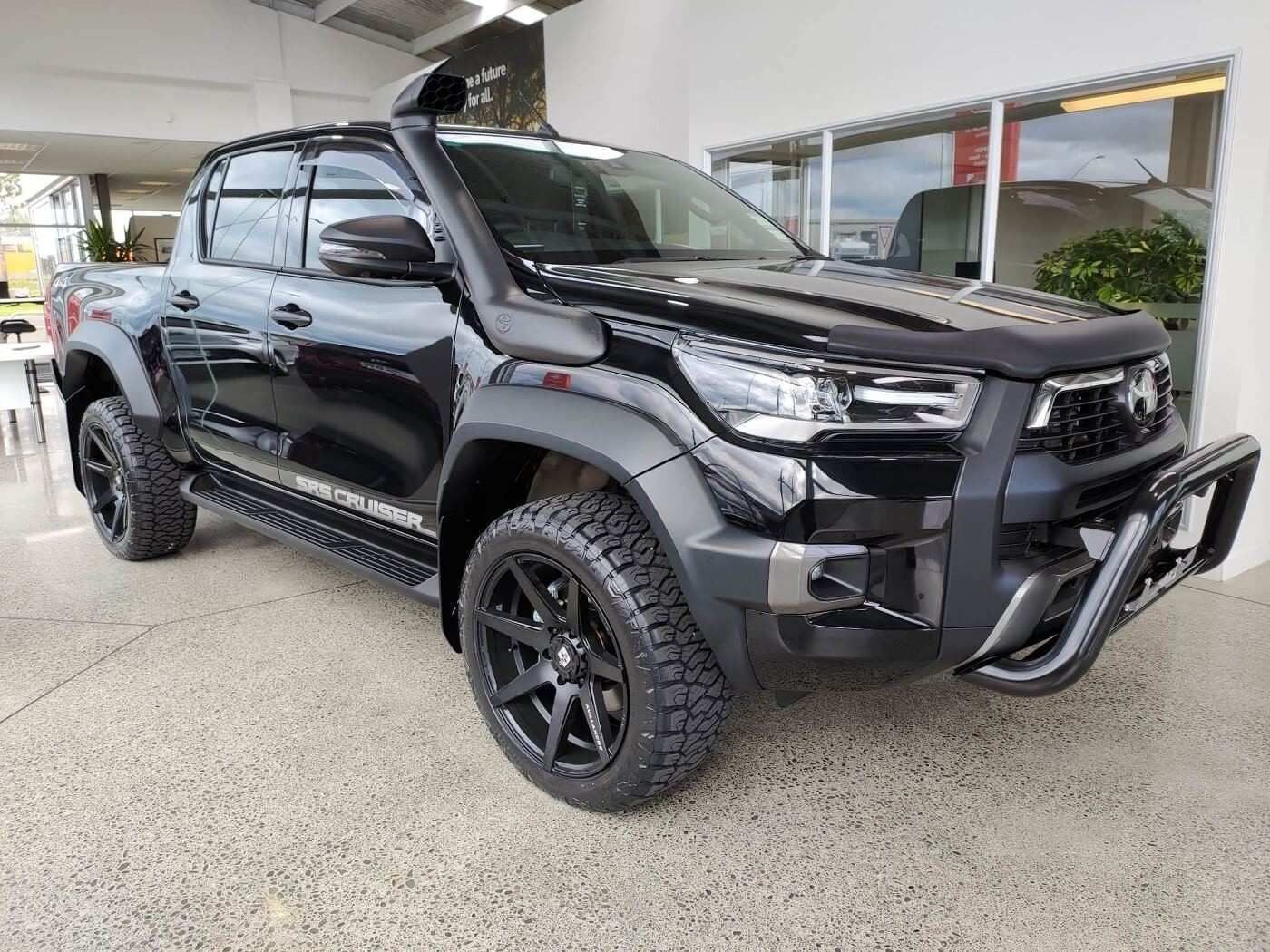 A Black Toyota Hilux Pickup Truck is Parked in a Showroom — Stamford Tyres In Ballarat Central, VIC