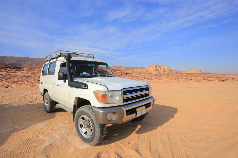 A White Suv is Parked in the Middle of a Desert — Stamford Tyres In Ballarat Central, VIC