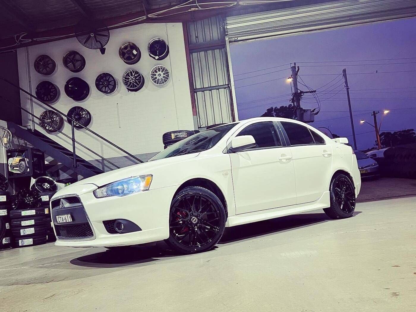 A White Car is Parked in Front of a Building — Stamford Tyres In Ballarat Central, VIC