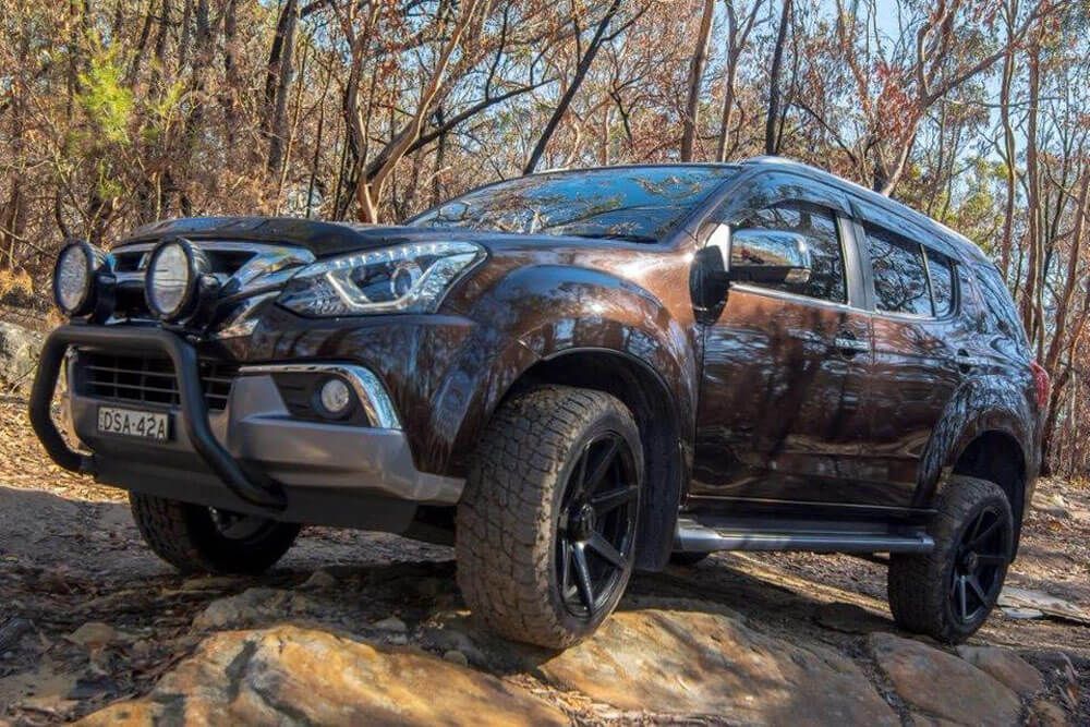 A Brown Suv is Parked on a Rocky Road in the Woods — Stamford Tyres In Ballarat Central, VIC