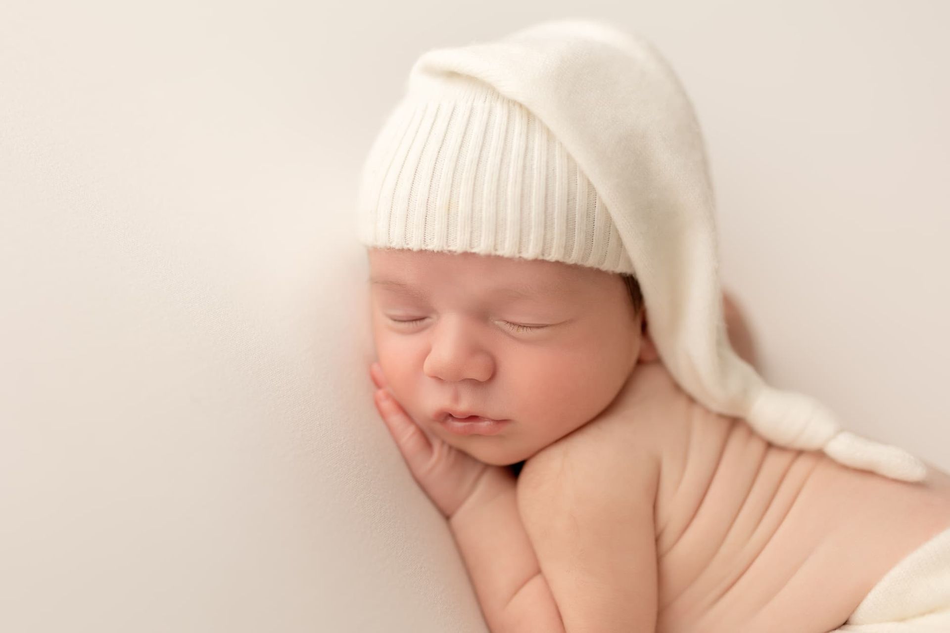 sleeping newborn baby posed during professional newborn photography session in Bergen County NJ