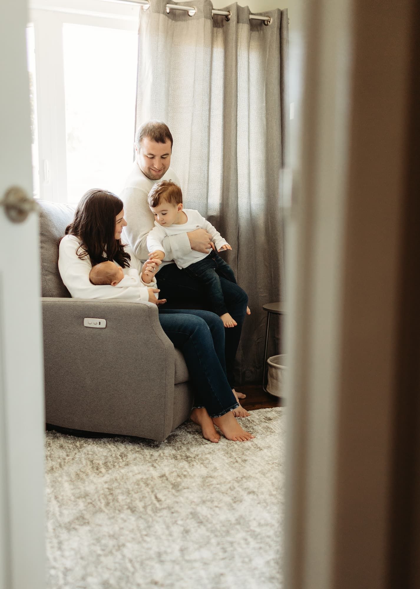 Family with newborn and toddler during in-home newborn session in Ridgewood NJ