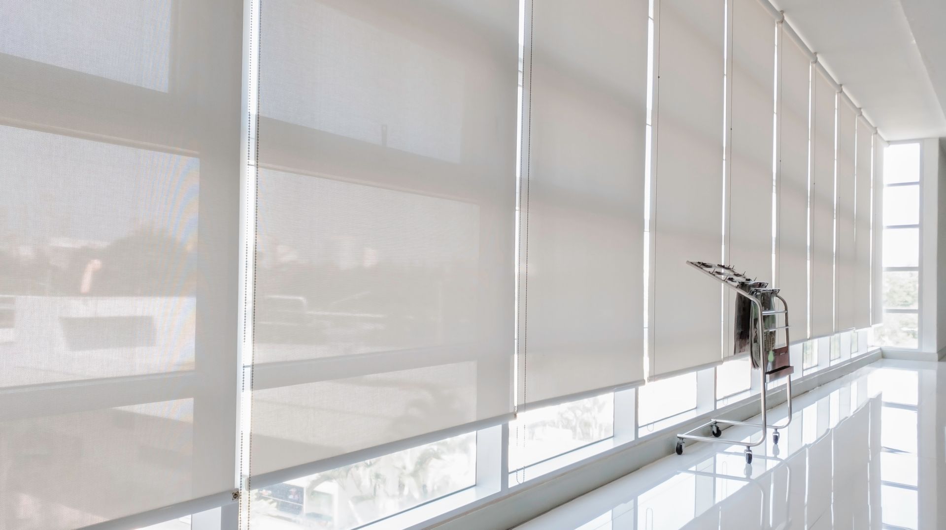 An office building with a set of motorized shades