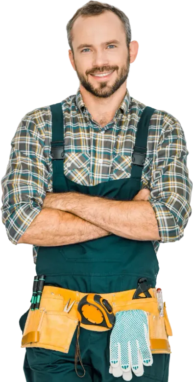 Man with a beard wearing overalls and a tool belt, arms crossed, smiling.
