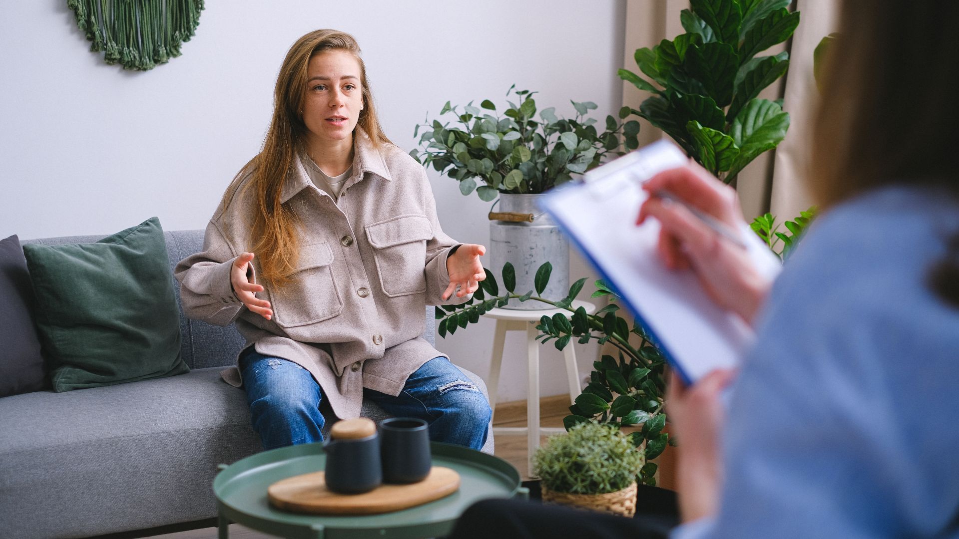 Christian counselor providing compassionate anxiety therapy in a comfortable office setting