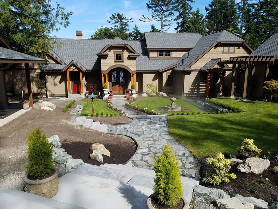 a large house with a stone walkway leading to it