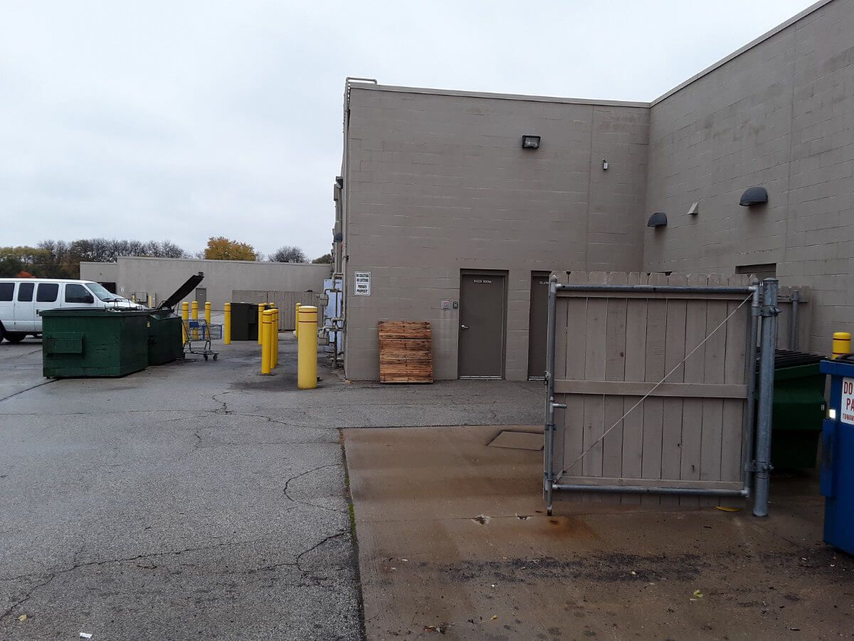 Power Washing a dumpster pad area at commercial property in Ohio.