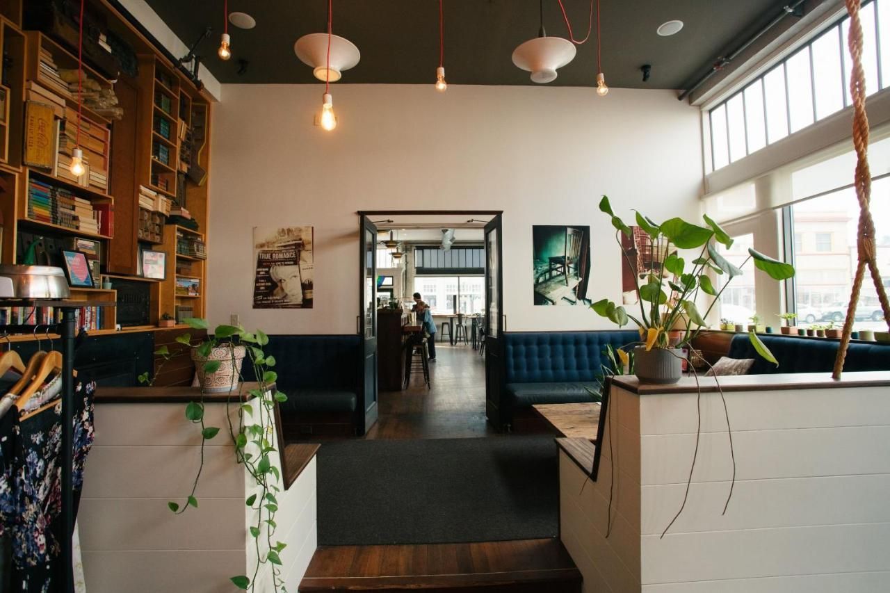 A large room with a lot of windows and a couch.