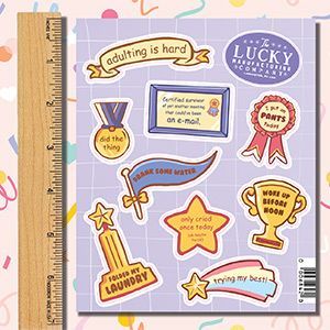A set of stickers with a ruler next to them.