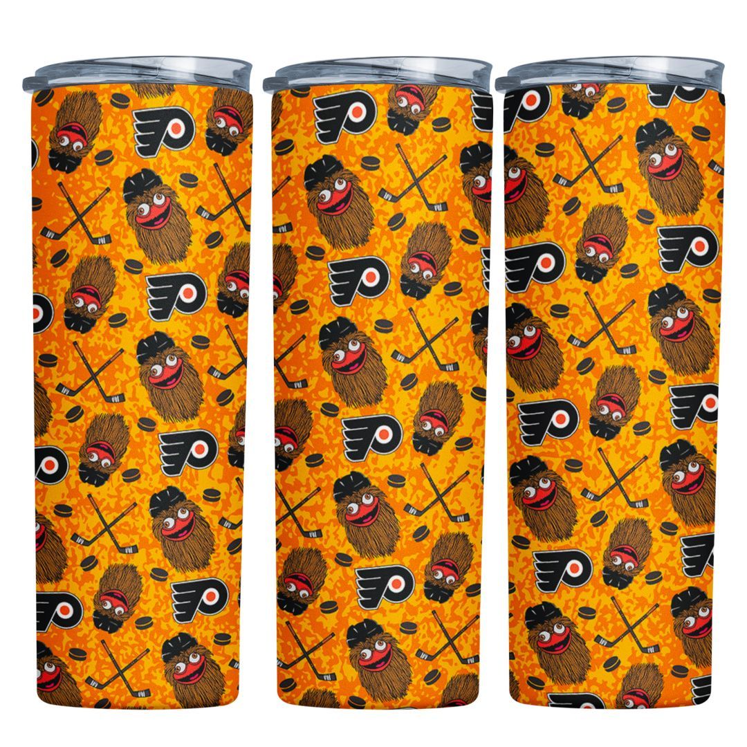 A stainless steel tumbler with a pattern of potatoes and hockey sticks on it.