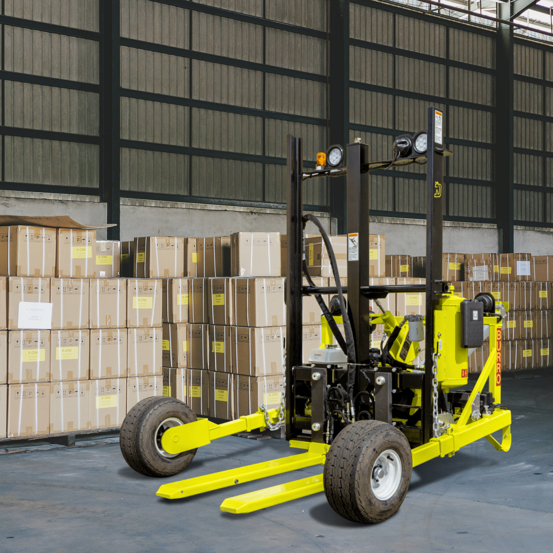 Yellow forklift in warehouse, loaded with boxes in background.