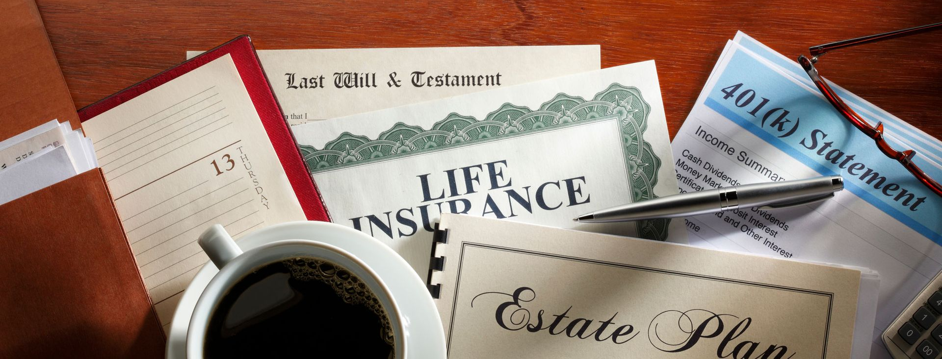 Coffee mug sitting on top of several estate planning documents.