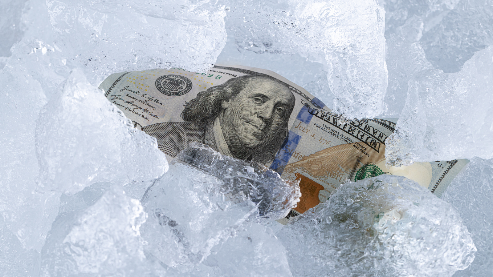 $100 dollar bill in ice