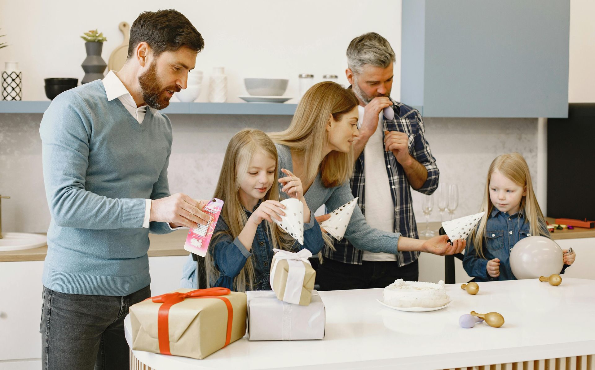 blended family in a kitchen greeting ready for a party