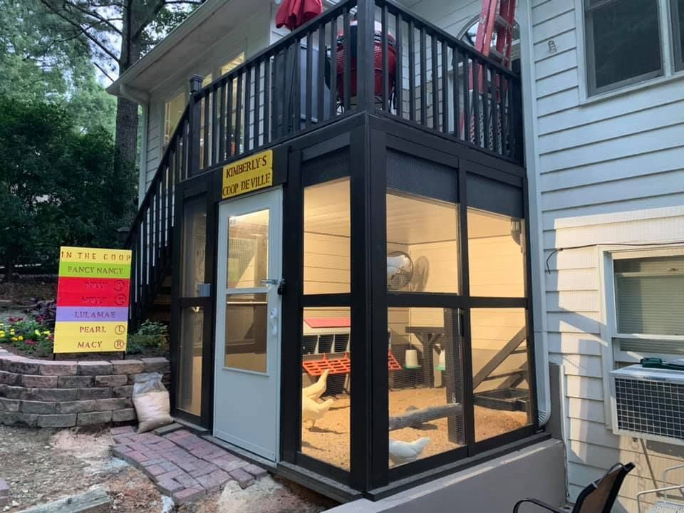 A house with a screened in porch and stairs