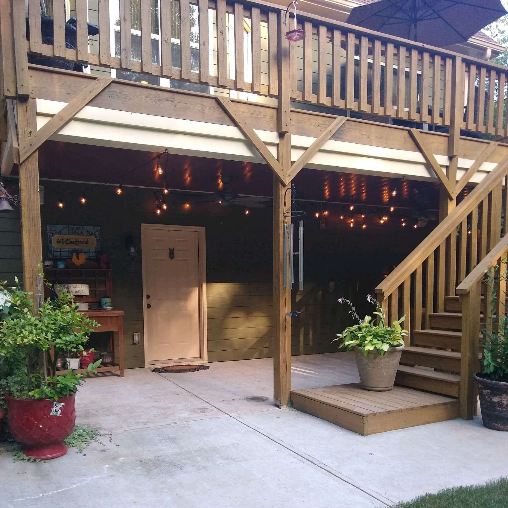 A wooden deck with stairs leading up to it