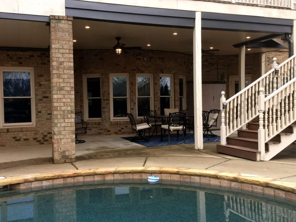 A house with a swimming pool and stairs leading up to it
