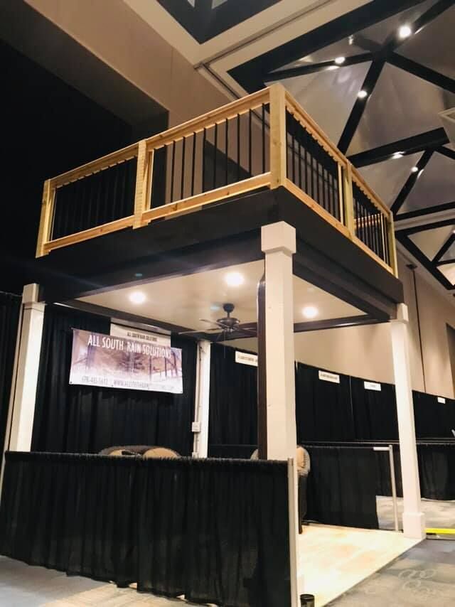 A large room with a balcony and a sign that says ' a ' on it