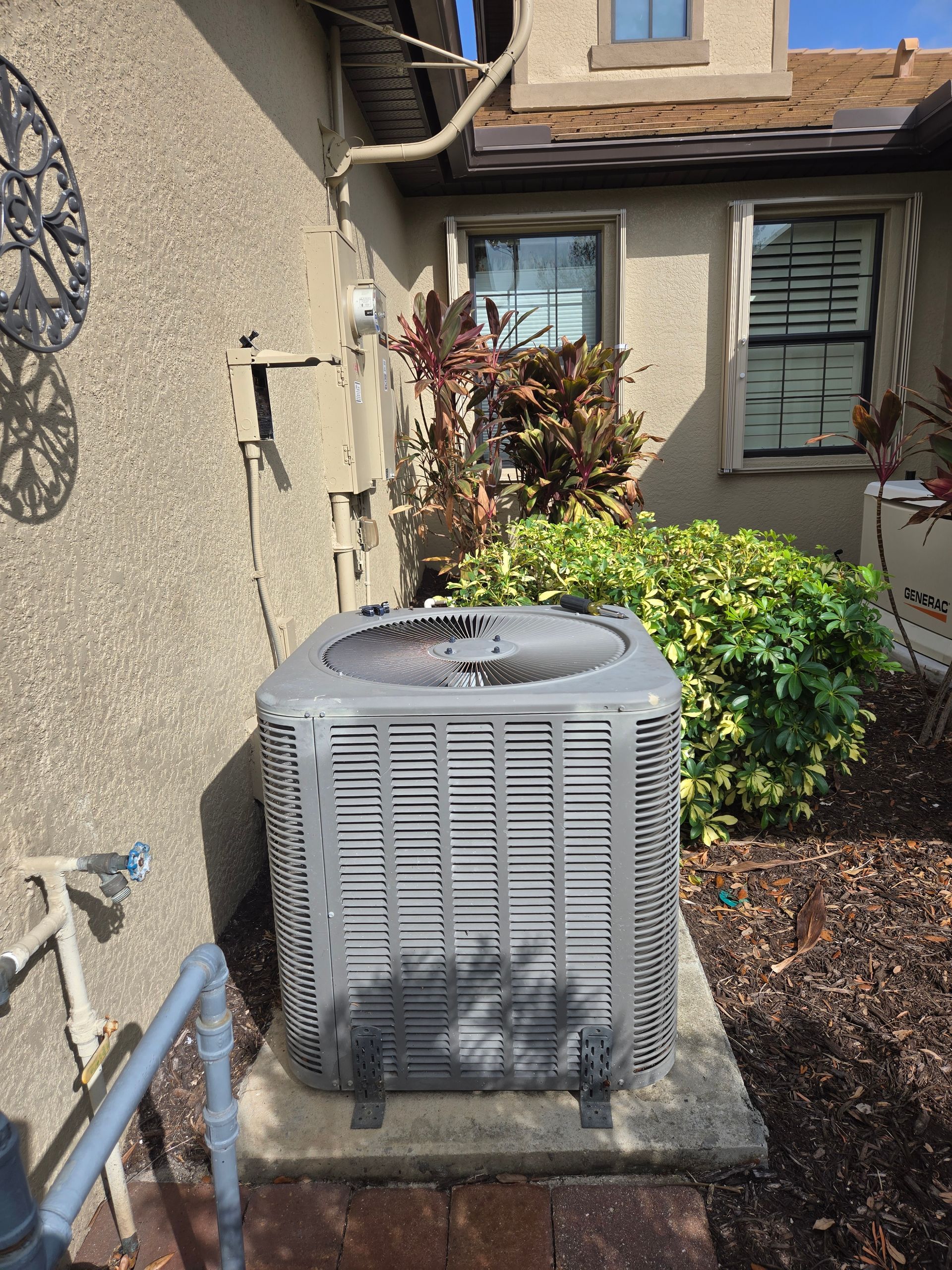 HVAC unit attached to ceiling, showing ductwork, insulation, and some discoloration.