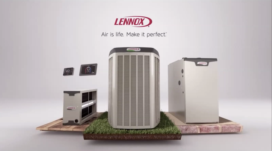 Lennox HVAC equipment display. Central AC unit, furnace, and accessories on a grass and brick platform.