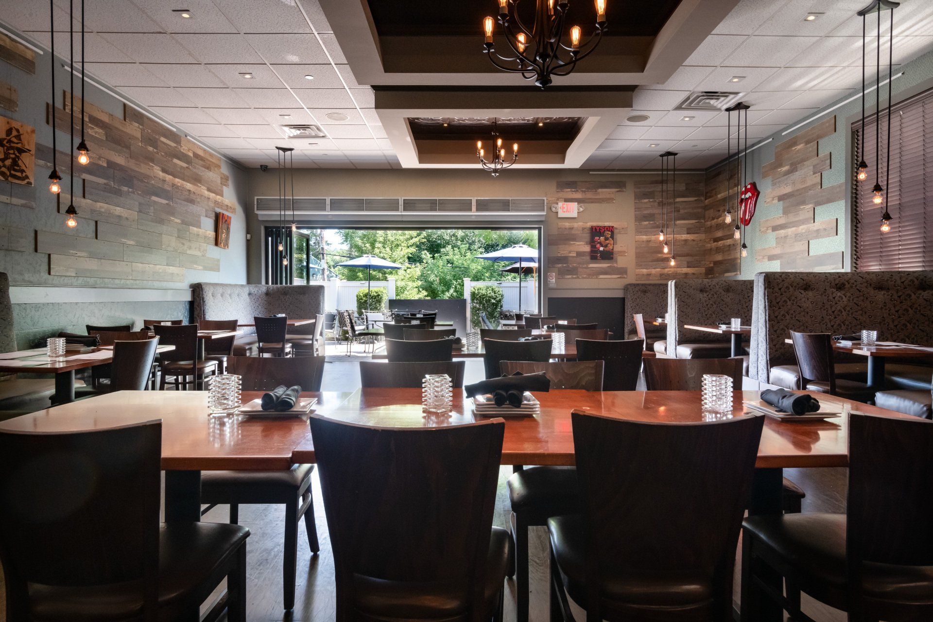 A restaurant with tables and chairs and a chandelier