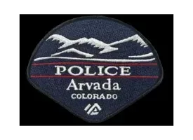 A patch that says police arvada colorado on it