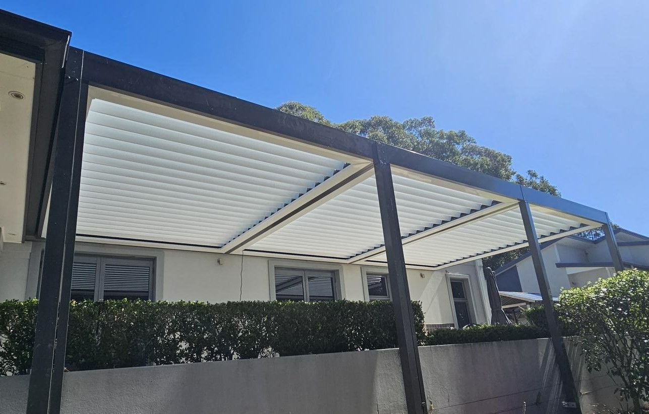 Pergola With Adjustable White Roof Panels — Narellan Home Improvement Centre In Newcastle, NSW